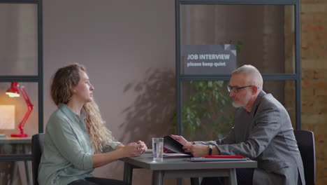 woman speaking with senior hr manager on job interview