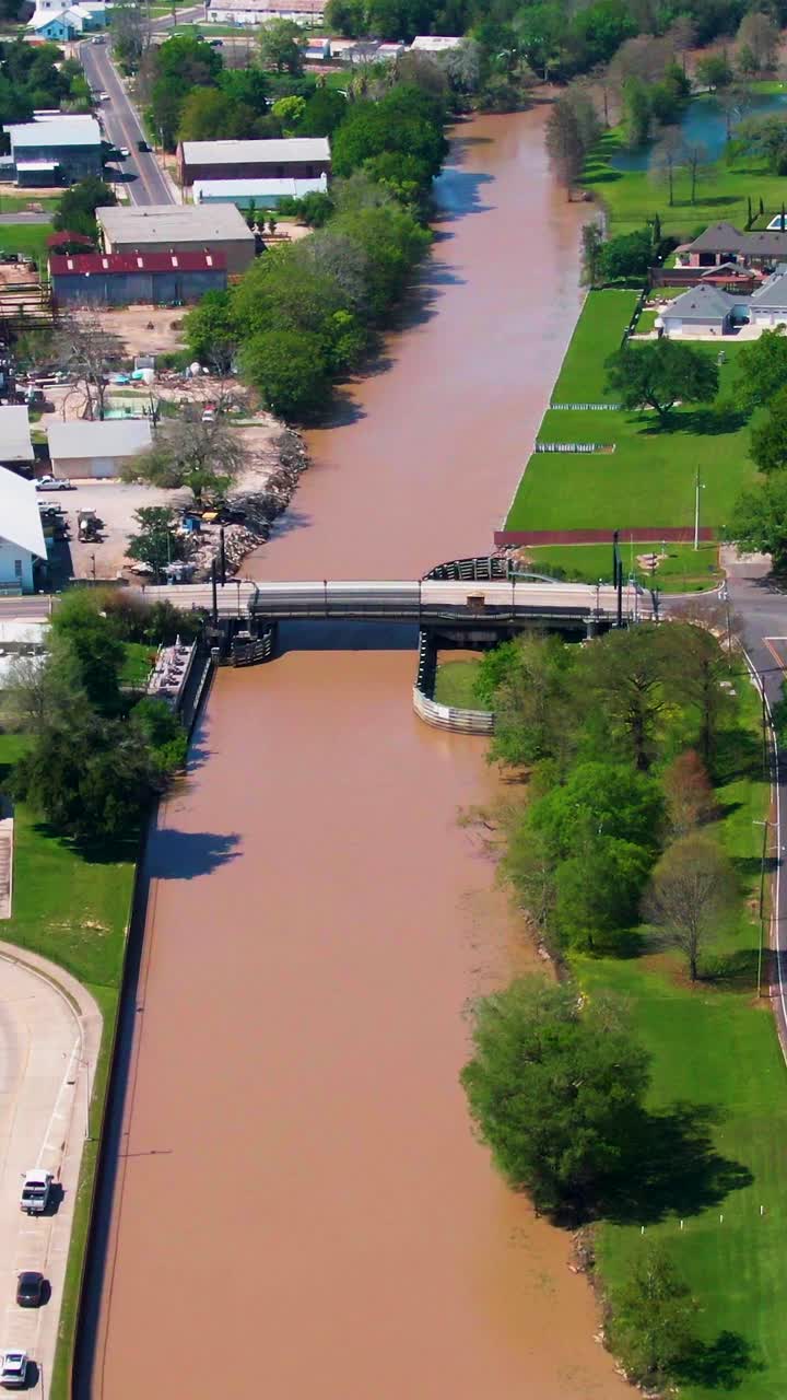 Vertical footage highlighting the Duperier Bridge in downtown New Iberia, LA, showcasing local infrastructure, transportation, and waterfront development