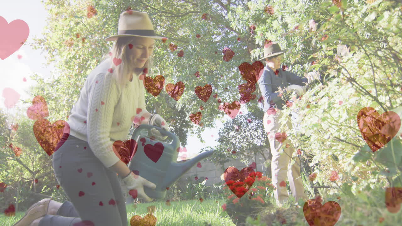 animación de emojis de corazón sobre la jardinería de las mujeres caucásicas.