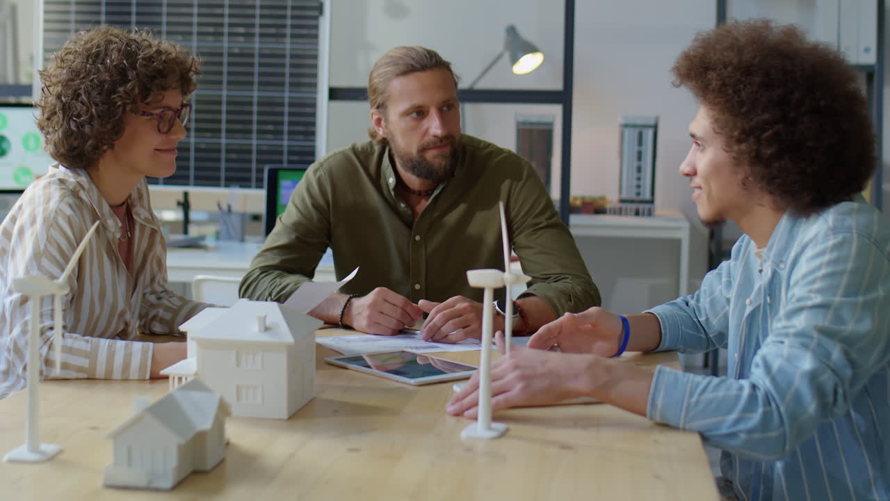 Diverse Engineers Discussing Renewable Energy Project