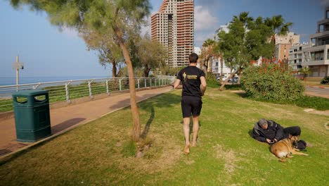 runner out on exercise while others relax by the seaside