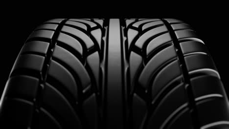 close up on a black car tire in motion. loop animation