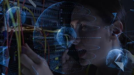 female it engineer speaking on smartphone, plugging cables in server room with holographic grid