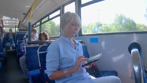 woman using mobile phone on a bus 4k