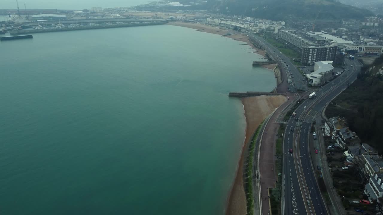 Aerial view of coastline with city and road