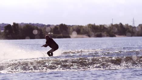 man making extreme jump on wakeboarding in slow motion. extreme water sports