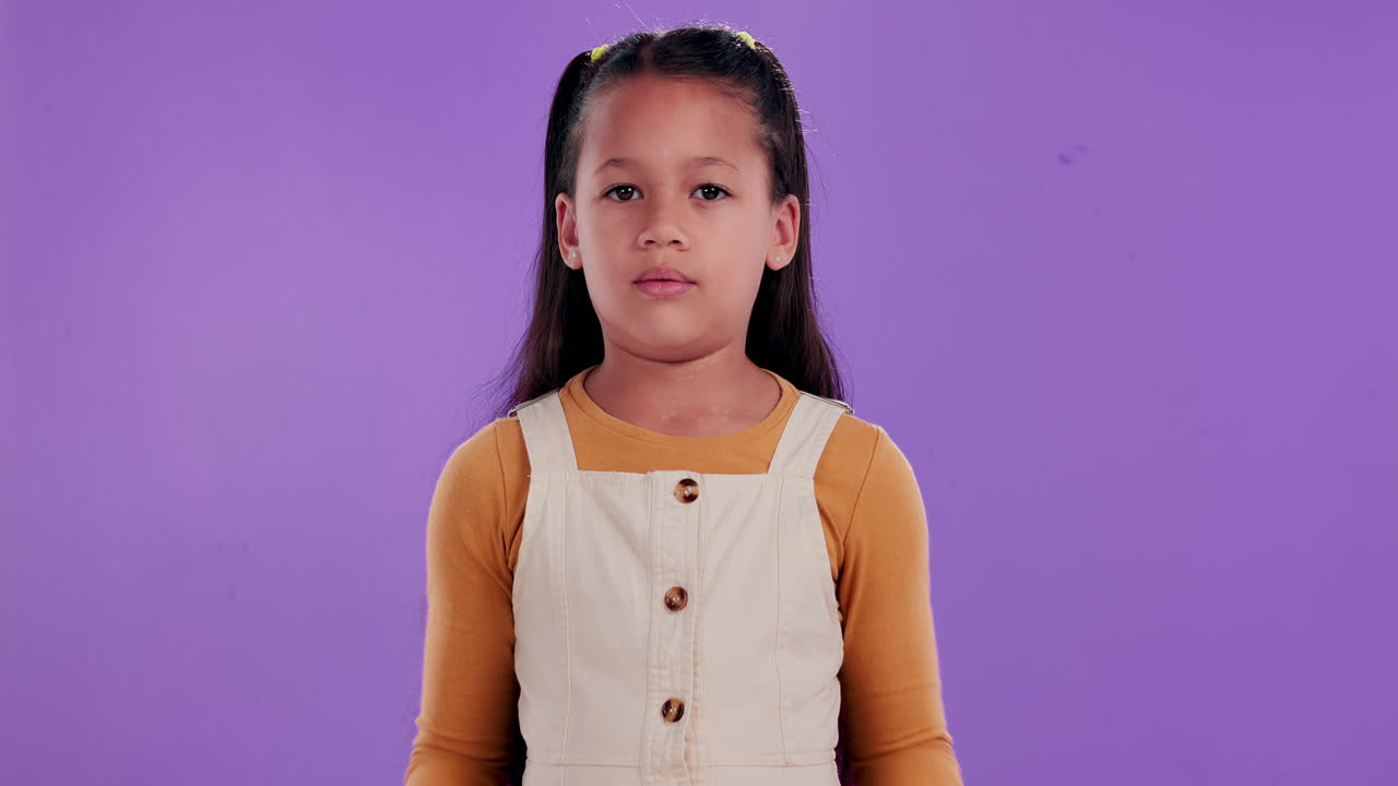 Girl shrugging with unsure expression