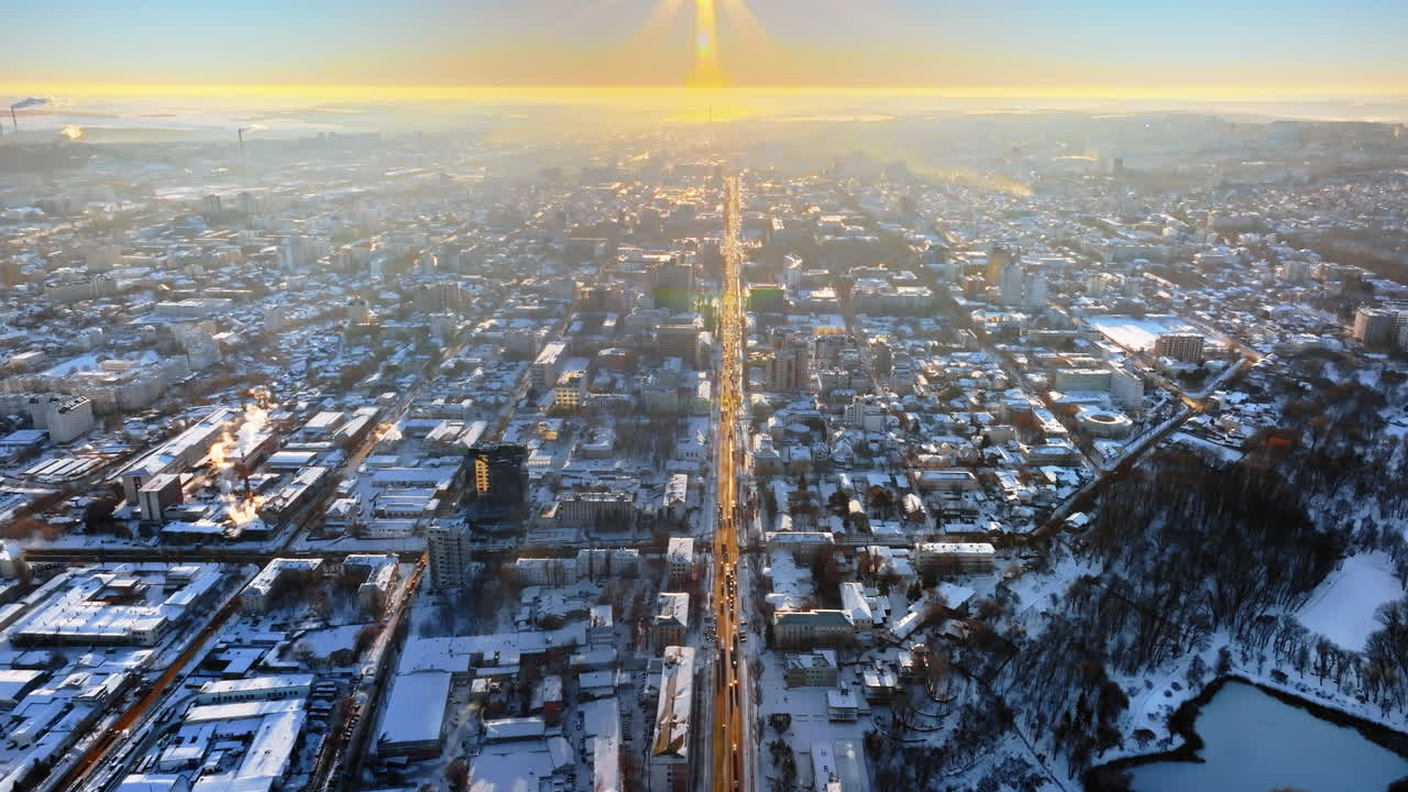 Aerial drone view of the city covered in snow. Sunrise during winter in Chisinau, Moldova