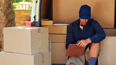 delivery man counting the parcels