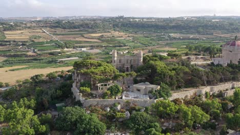 Aerial-View-Of-Hilltop-Tal-Virtu-Castle-Located-In-Rabat,-Malta