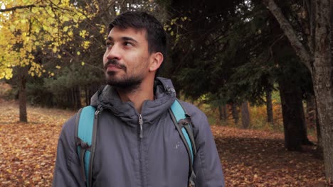 mountain wanderer in grey, taking a rest and enjoying the scenic landscape on an adventurous hiking journey