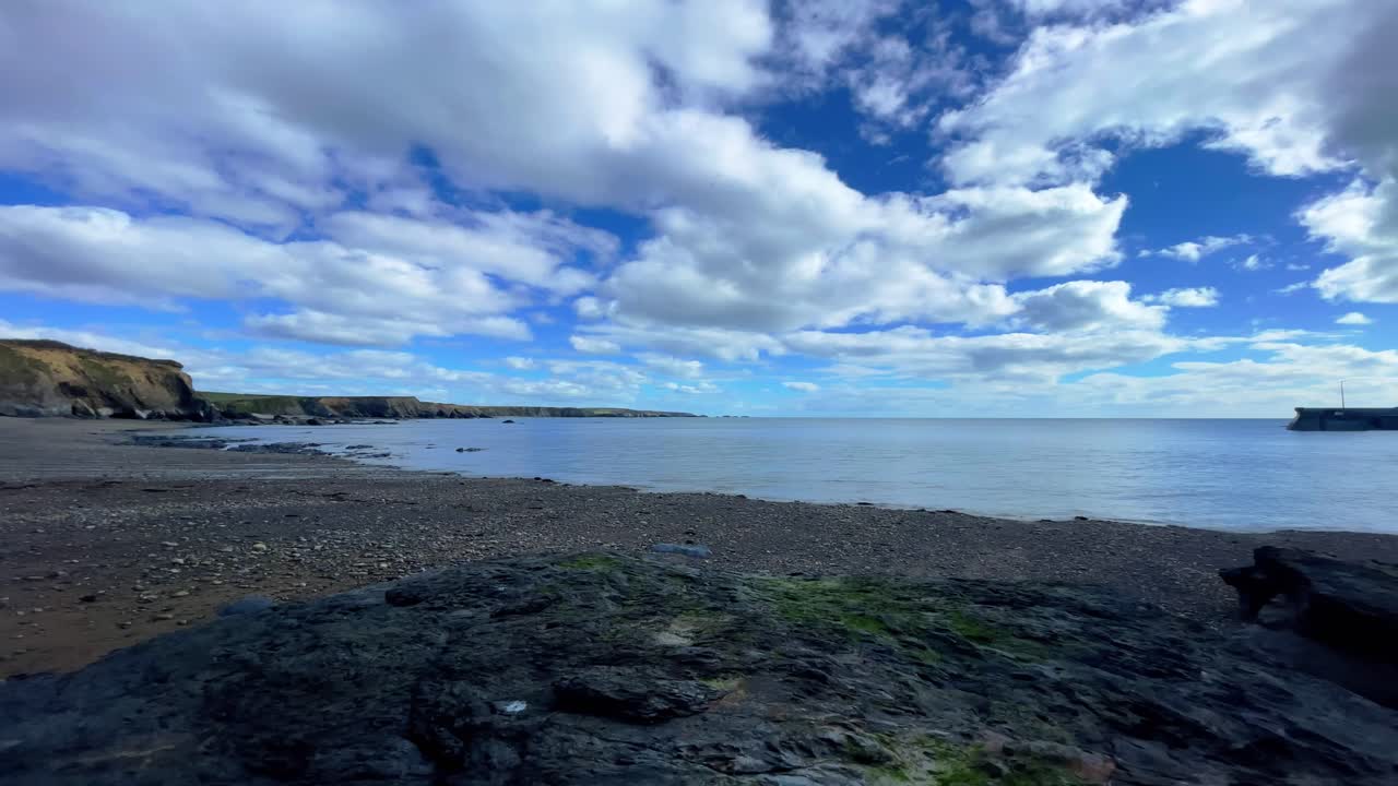 Ireland coast timelapse puffy clouds drifting over calm waters in bay Copper Coast Waterford Epic Locations