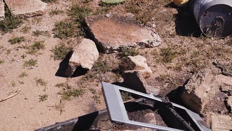 tilt-down from a discarded tire to electronic trash in the sonoran desert, scottsdale, arizona.