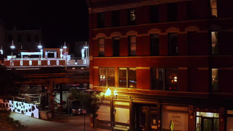 a late night, slow dolly zoom shot of an old motel along the illuminated streets of chicago