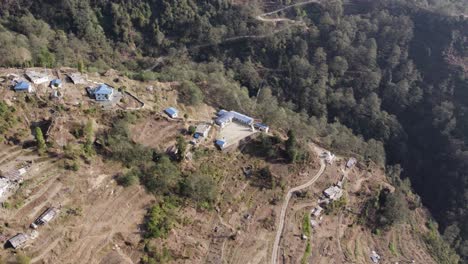 Aerial-Shot-of-a-Remote-School-in-the-Nepalese-Mountains-on-a-Clear-Afternoon,-Chofku-School,-Helambu