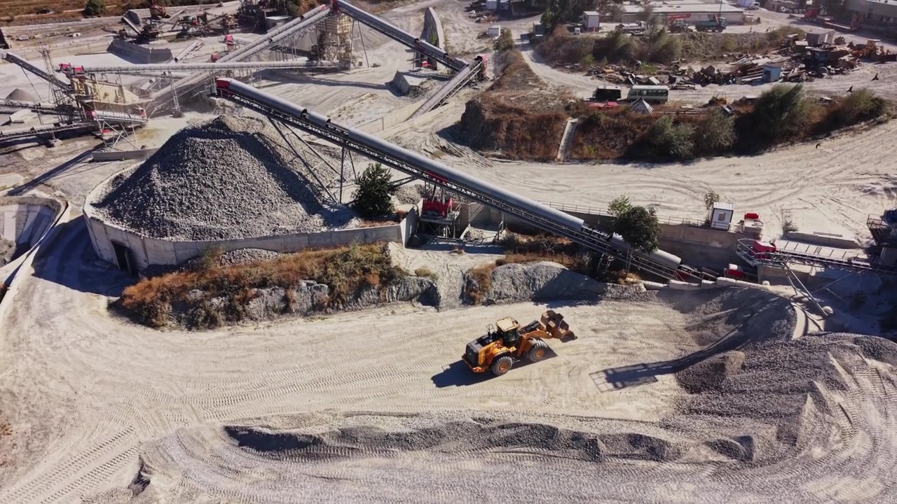 Construction site with machinery and materials in daytime