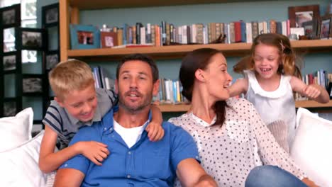 Children-surprised-parents-on-couch