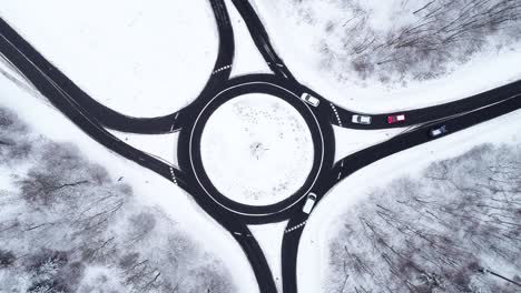 traffic circle and snow-covered landscape - aerial view