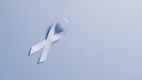 Video-of-pale-blue-prostate-cancer-ribbon-on-pale-blue-background
