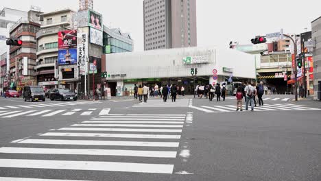 tokyo, japan - 8th oct. 2018 : jr, metro, yoyogi station, 4k, camera fixed, angle neutral. transited pedestrian crossing of the station. west exit yoyogi station.
