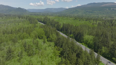 pan over beautiful bellingham, washington landscape with the highway cutting through on a gorgeous day