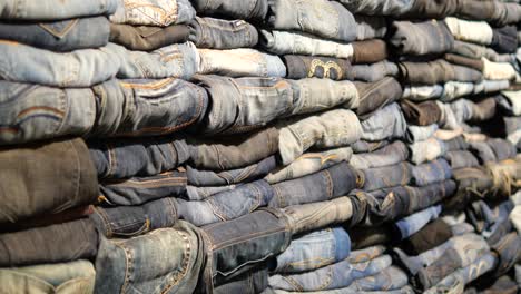 stack of jeans in a retail store