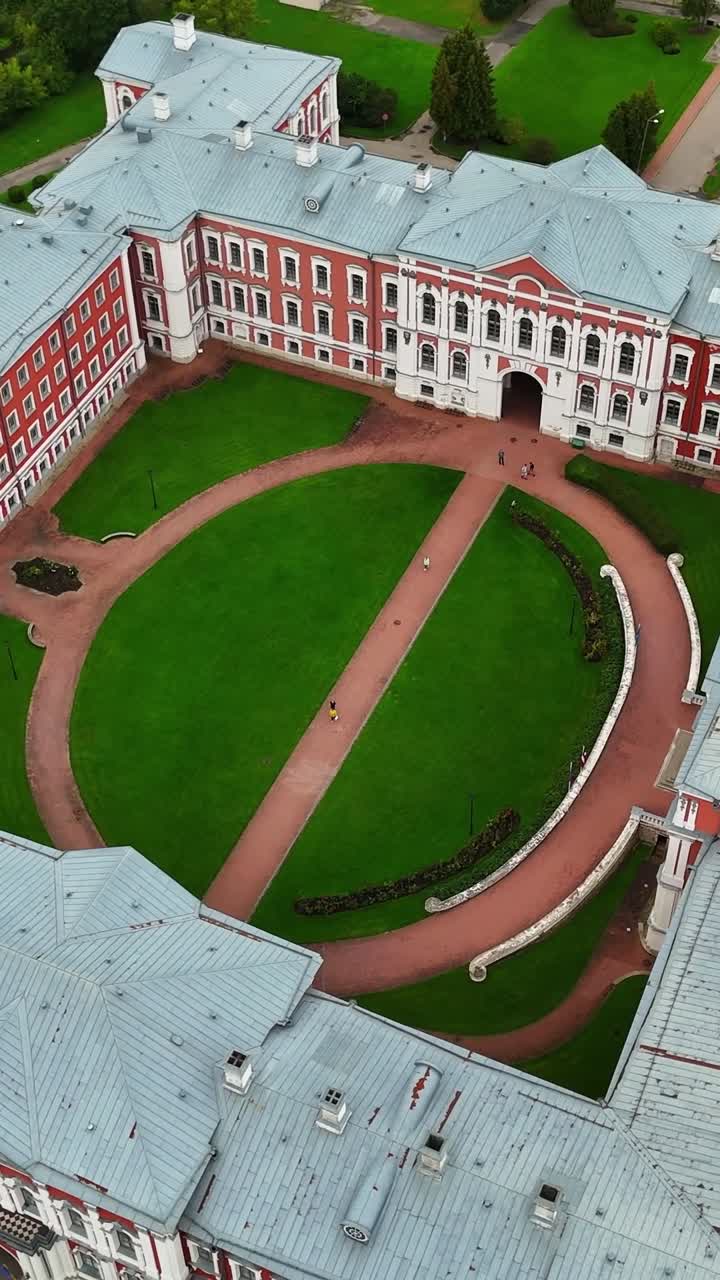 Drone vertical footage showing an aerial view of Jelgava Palace with its central courtyard and landscaped gardens in Jelgava, Latvia