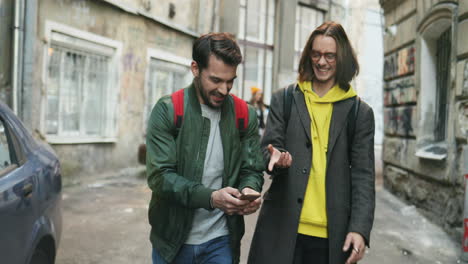 close-up view of young caucasian friends walking down the street