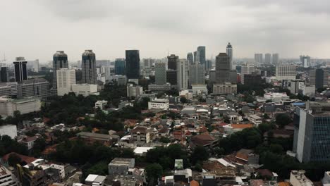 panorama drone flight over jakarta downtown with skyscraper buildings in jakarta city