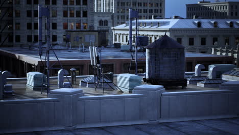 a rooftop view of a city with a water tower