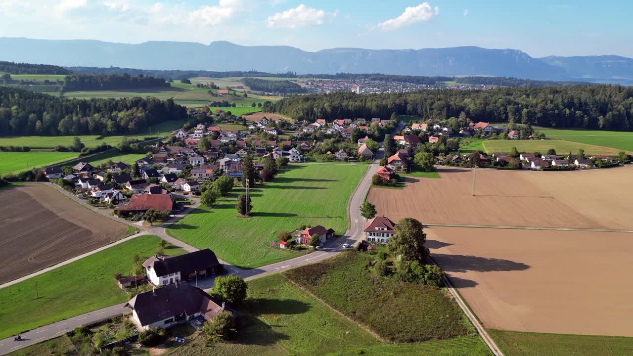 Scenic Drone Flight Over Rural Kr&auml;iligen near B&auml;tterkinden on the entrance to the emmental region in Switzerland