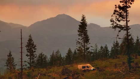 pan of van wandering off-road exploring wilderness mountains