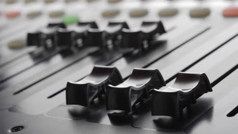 Digital-audio-console.-Motorized-sliders.-Close-up