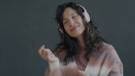woman enjoying music with headphones