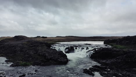 Drone-flight-over-a-waterfall-in-Iceland