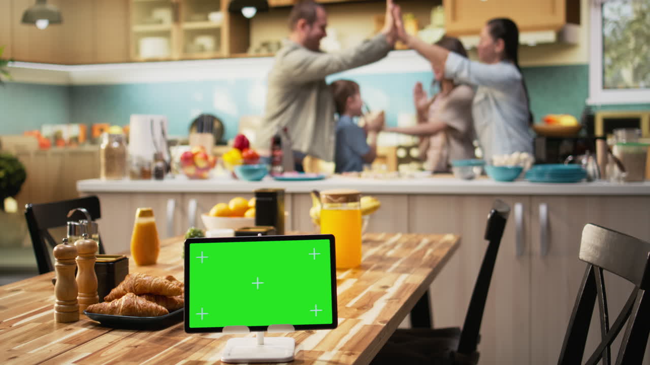 Mockup screen on tablet with young family having fun during weekend activity