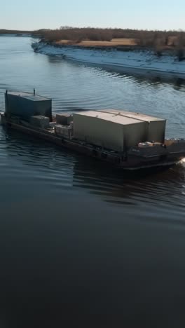 barge on river in winter