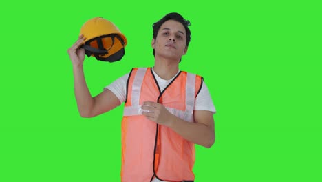 Indian-construction-labour-removing-the-helmet-Green-screen