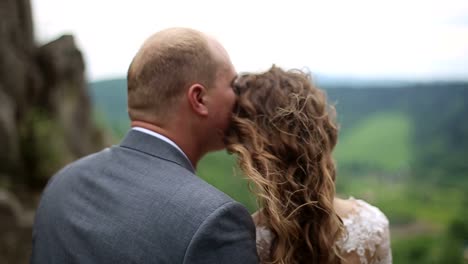 romantic wedding moments on a scenic mountain top