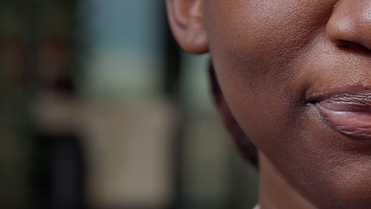 Macro shot of african american woman moving her lips