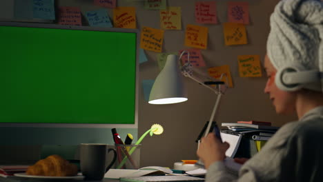 Cheerful-woman-looking-mockup-computer-at-home-closeup.-Housewife-writing-notes