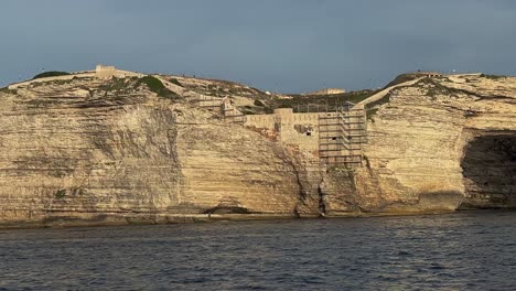 wide cave in bonifacio cliff in corsica, france