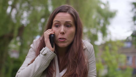 Stressed-Or-Angry-Woman-Outdoors-With-Financial-Worries-About-Cost-Of-Living-Crisis-Debt-And-Paying-Bills-Talking-On-Mobile-Phone-10