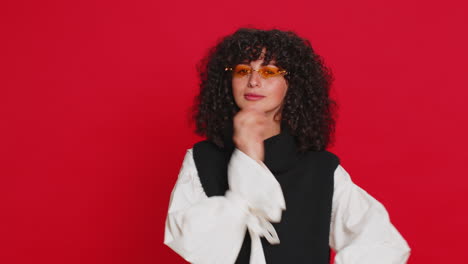 stylish smiling caucasian young woman with curly hair wearing orange sunglasses glad expression