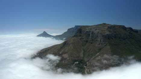 aerial: judas peak above the clouds cape town