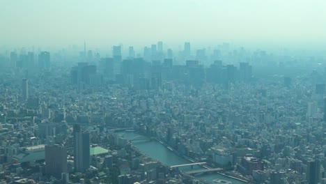 zoom out, aerial view of tokyo with skylines from skytree tower