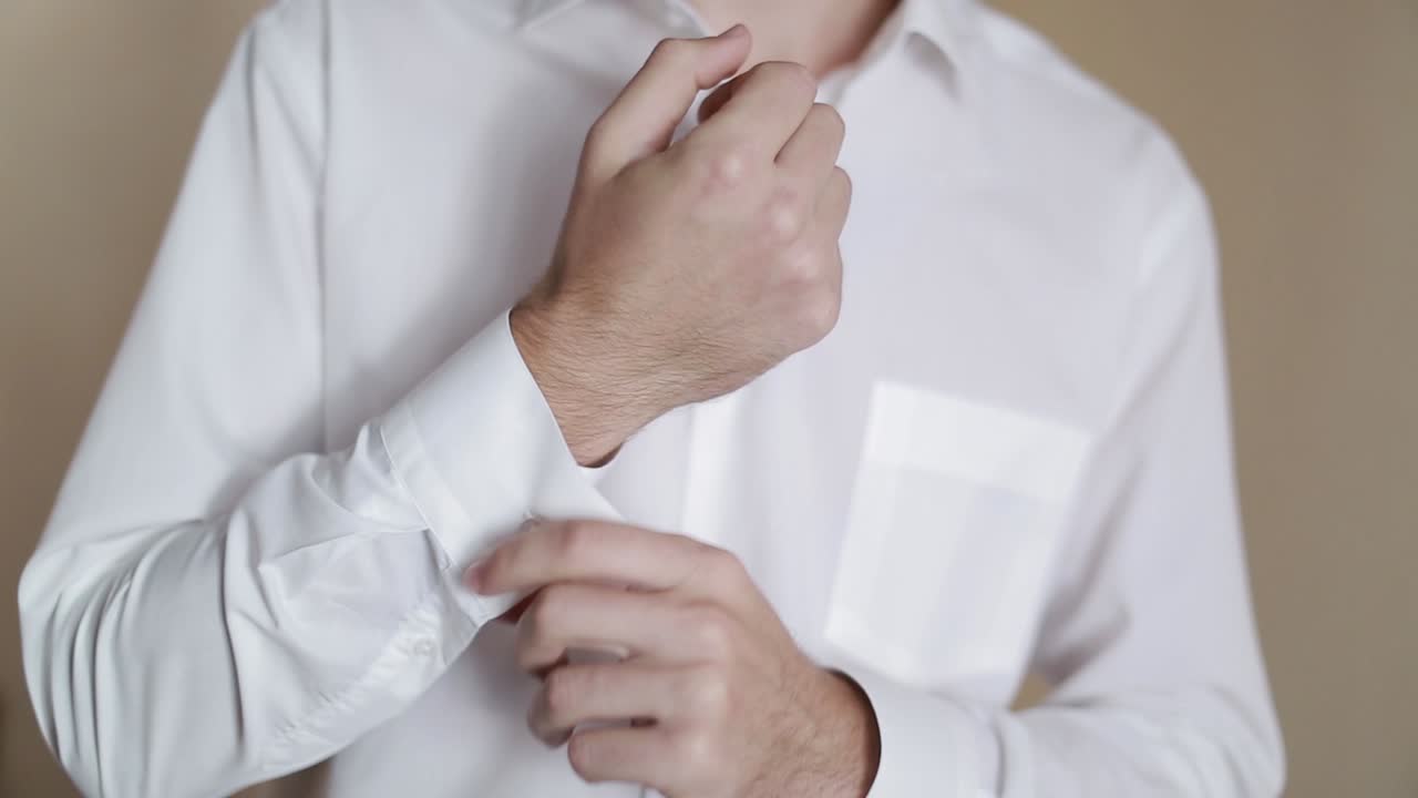 Groom Getting Ready Dressed. Happy gorgeous handsome groom getting ready dressed in the morning