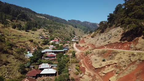 aerial shot of houses between mountains in nebaj, quiche in guatemala