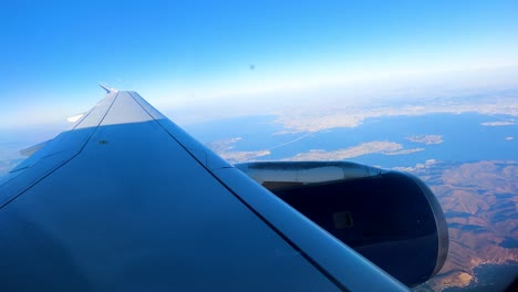 Flying-over-San-Francisco-on-a-commercial-flight---aerial-hyper-lapse-out-the-plane's-window-with-the-wing-in-view