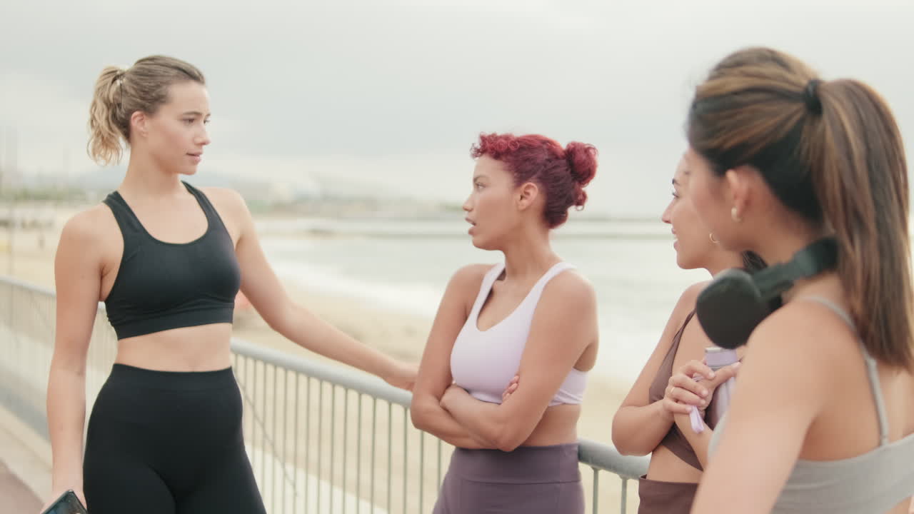 Fitness Friends Talking By The Beach